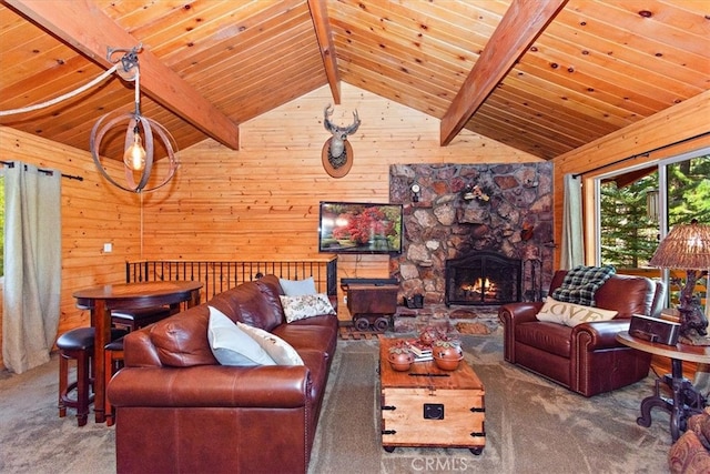 living room with wooden walls, wood ceiling, a fireplace, and carpet flooring