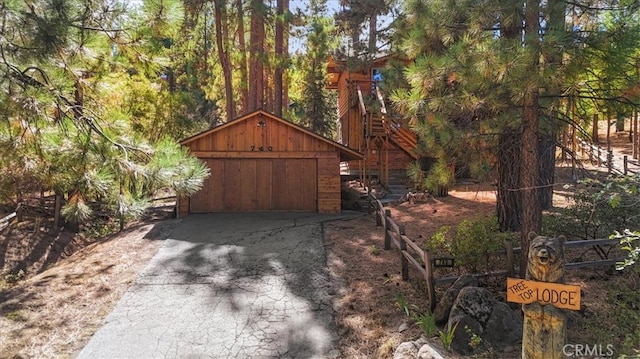 view of front of house featuring an outdoor structure and a garage