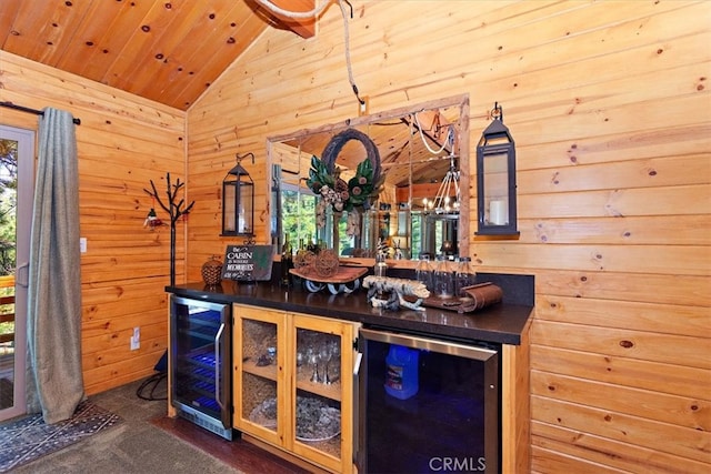 bar with wine cooler, wooden ceiling, lofted ceiling, and wooden walls