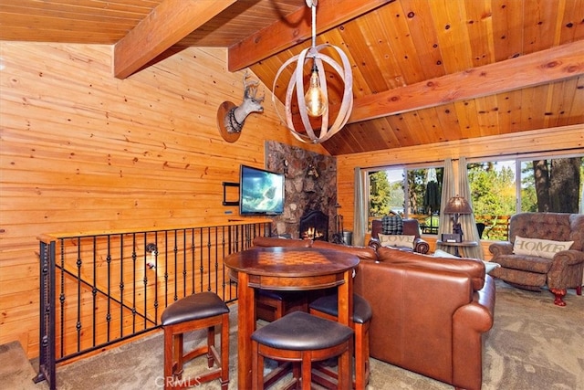 living room featuring carpet flooring, wooden ceiling, wood walls, a stone fireplace, and lofted ceiling with beams