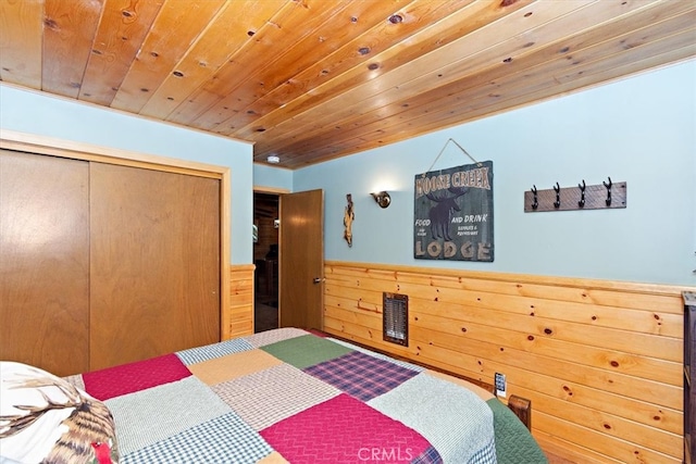 bedroom featuring a closet and wooden ceiling