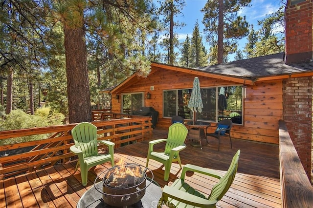 deck featuring a fire pit