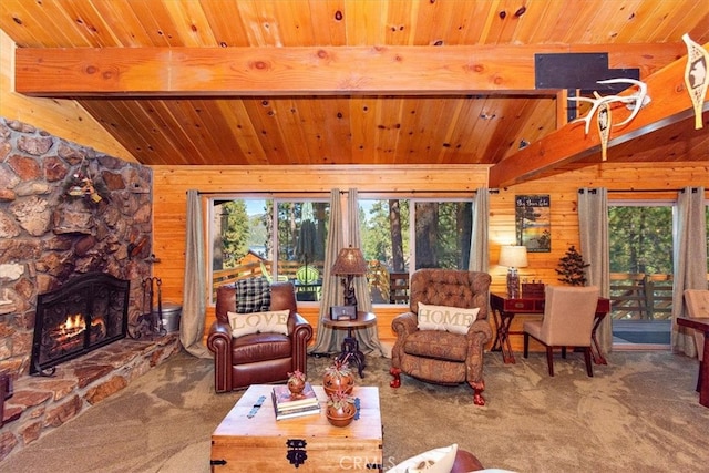 living room with wood ceiling, wood walls, lofted ceiling with beams, and a fireplace