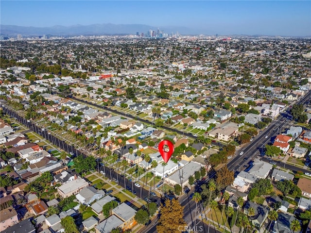 birds eye view of property with a mountain view