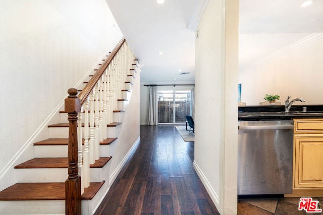 interior space featuring sink, dark hardwood / wood-style flooring, and crown molding