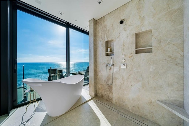 bathroom with floor to ceiling windows, a water view, and shower with separate bathtub