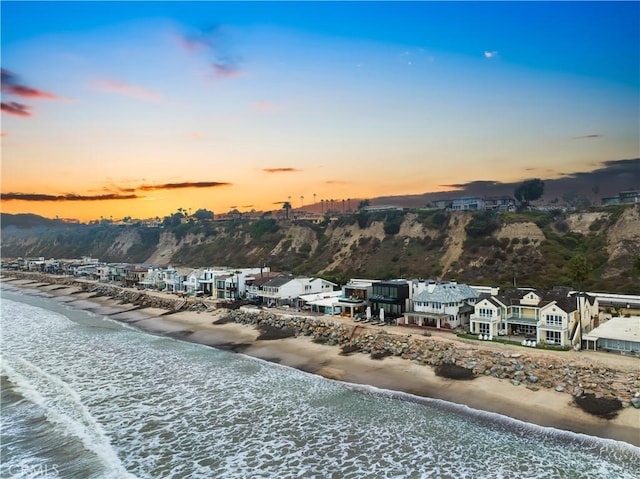 property view of water featuring a beach view