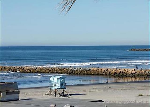 view of water feature with a beach view