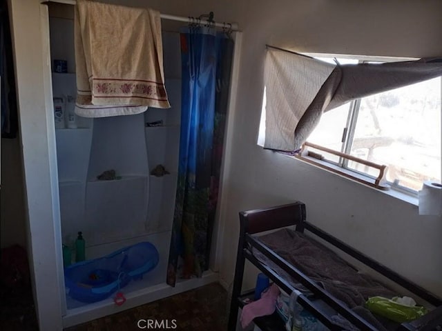 bathroom featuring a shower with curtain