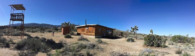 view of property exterior featuring a mountain view