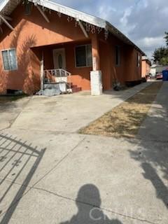 1227 Rolland Curtis Pl Unit 1227-1/2, Los Angeles, CA 90037 - view of property exterior featuring a porch and driveway