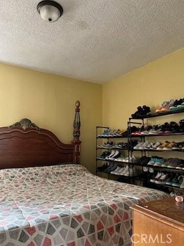 bedroom featuring a textured ceiling