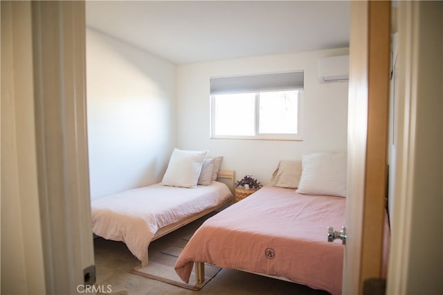 bedroom with an AC wall unit and carpet