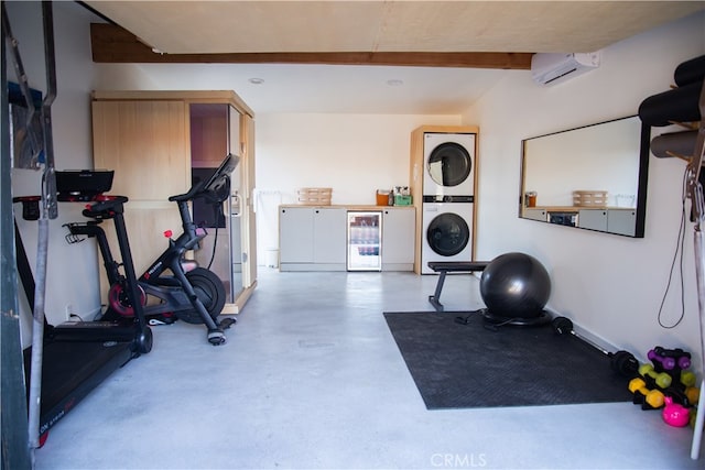 workout area featuring stacked washer / dryer, beverage cooler, and an AC wall unit