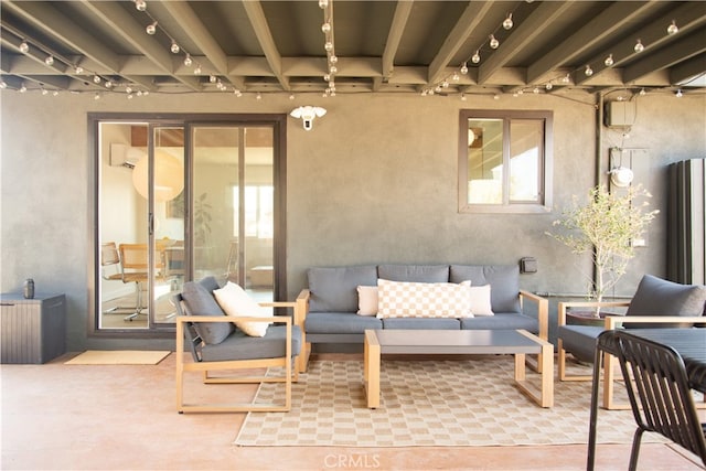 view of patio / terrace with an outdoor living space and a wall mounted AC