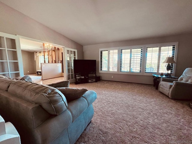 carpeted living room with lofted ceiling