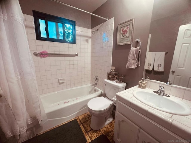 full bathroom with vanity, toilet, and shower / bath combo