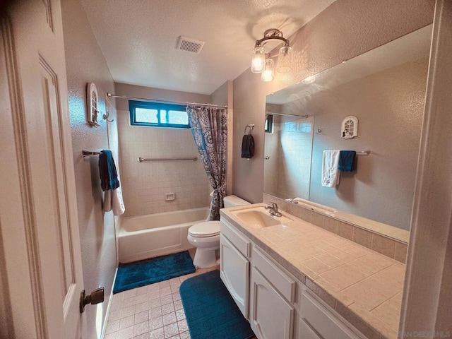 full bathroom with shower / bathtub combination with curtain, vanity, a textured ceiling, tile patterned floors, and toilet