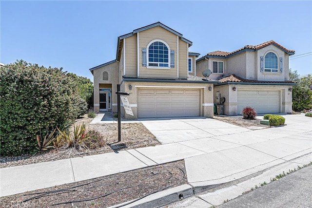 425 Bakeman Ln, Arroyo Grande, CA 93420 - view of front of house featuring an attached garage, driveway, and stucco siding