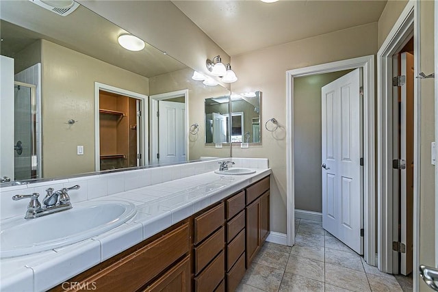 425 Bakeman Ln, Arroyo Grande, CA 93420 - full bath with double vanity, a stall shower, and a walk in closet