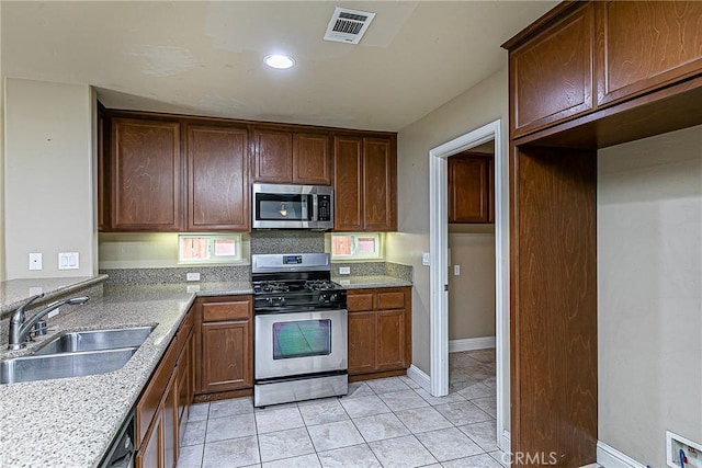 425 Bakeman Ln, Arroyo Grande, CA 93420 - kitchen featuring appliances with stainless steel finishes, light tile patterned floors, and recessed lighting