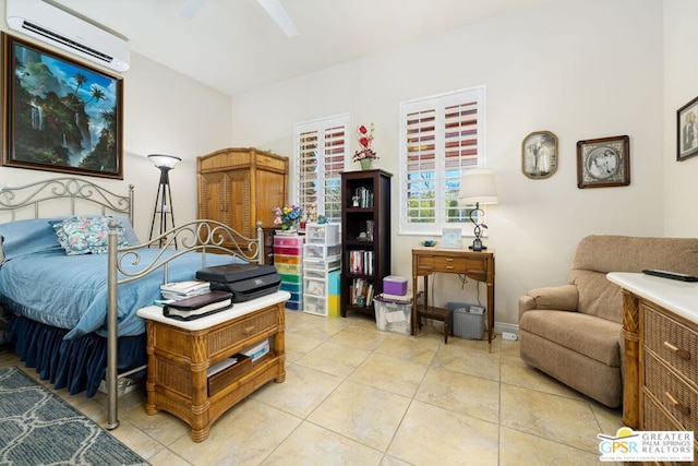 tiled bedroom featuring a wall unit AC and ceiling fan