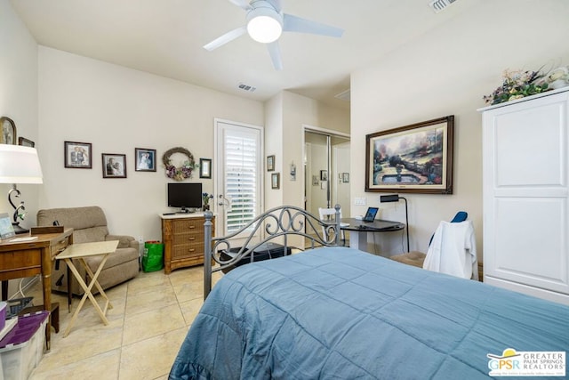 tiled bedroom featuring ceiling fan and a closet