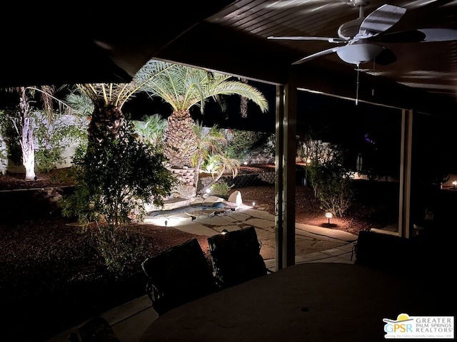 view of patio featuring ceiling fan