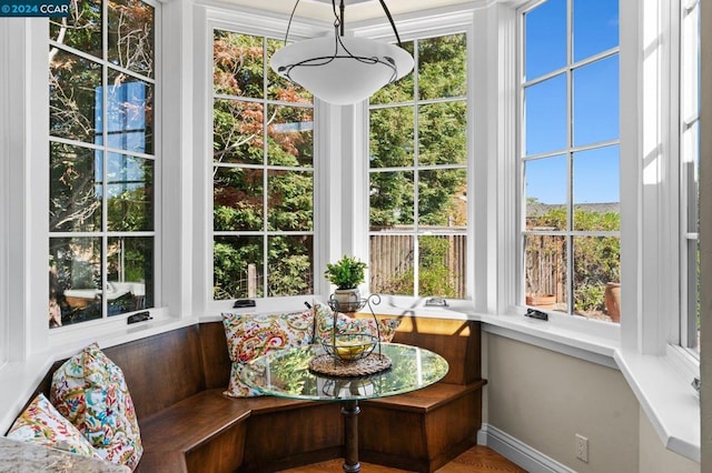 sunroom / solarium featuring a wealth of natural light and breakfast area