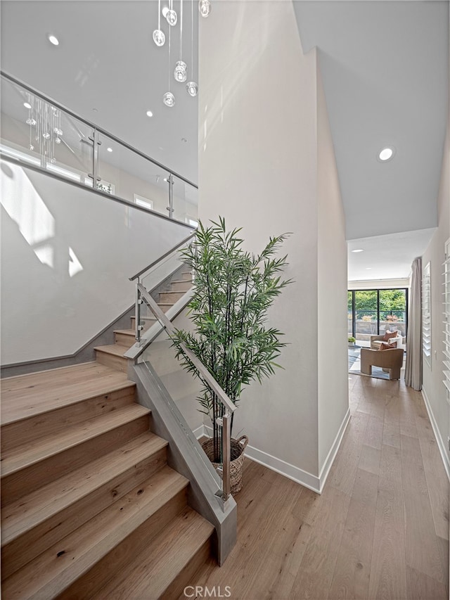 stairs with wood-type flooring