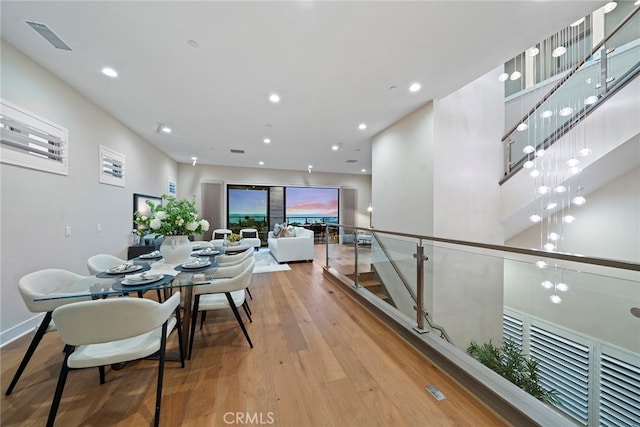 dining space featuring light wood-type flooring