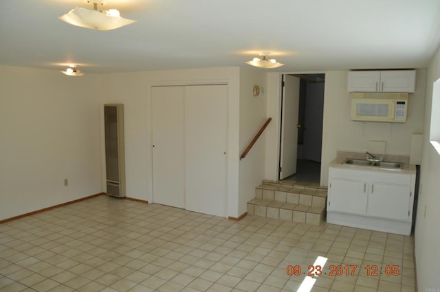 interior space featuring sink and light tile patterned floors