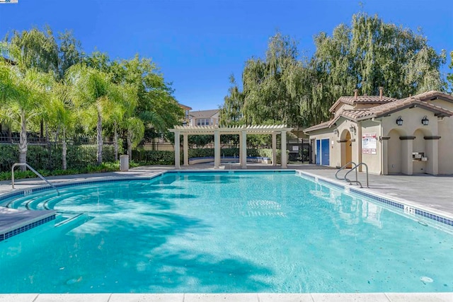 view of pool featuring a patio area and a pergola