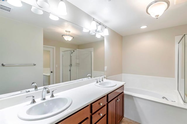 bathroom featuring vanity, tile patterned floors, and separate shower and tub