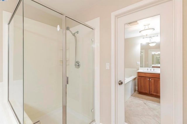 bathroom featuring vanity, plus walk in shower, and tile patterned floors