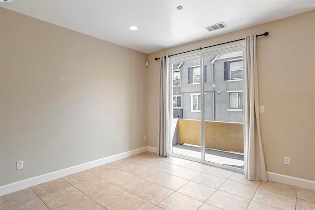 empty room with light tile patterned floors