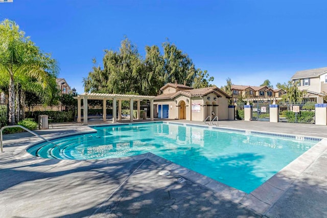 view of swimming pool featuring a patio area and a pergola