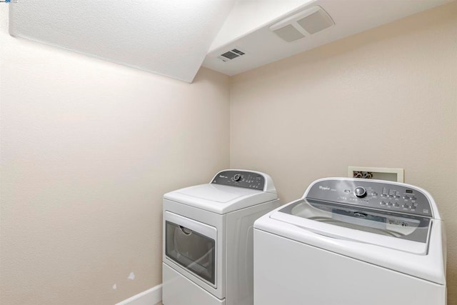 laundry room with independent washer and dryer