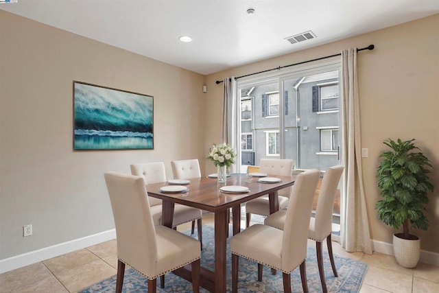 dining area with light tile patterned floors