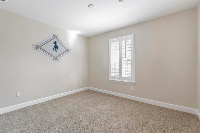 unfurnished room featuring carpet flooring