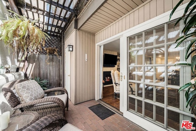 property entrance featuring a pergola