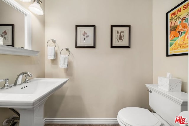 bathroom with toilet and sink