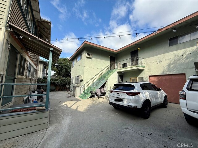 view of side of property with a balcony