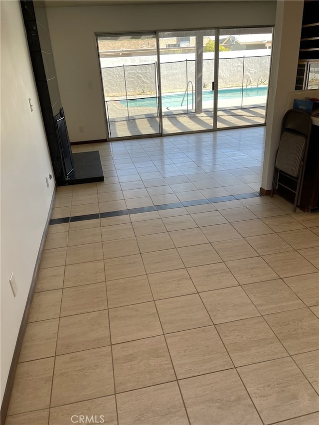 37800 Rudall Ave, Palmdale, CA 93550 - empty room featuring light tile patterned floors, baseboards, and plenty of natural light