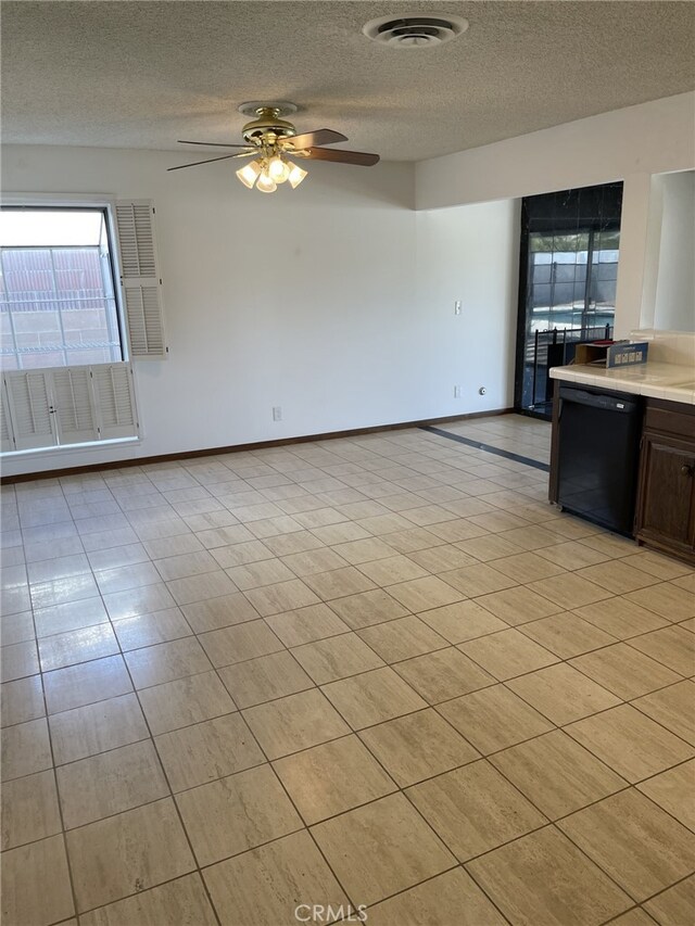 37800 Rudall Ave, Palmdale, CA 93550 - unfurnished dining area featuring healthy amount of natural light, a textured ceiling, a ceiling fan, and baseboards