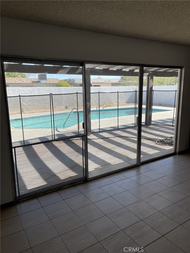 37800 Rudall Ave, Palmdale, CA 93550 - doorway featuring a textured ceiling and tile patterned flooring