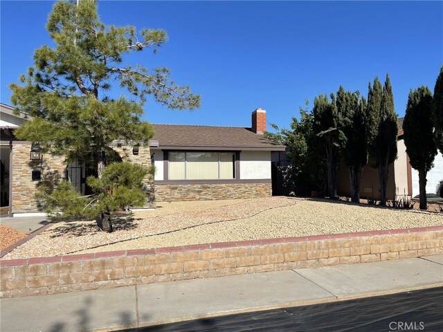 37800 Rudall Ave, Palmdale, CA 93550 - view of front of property featuring stone siding, stucco siding, and a chimney