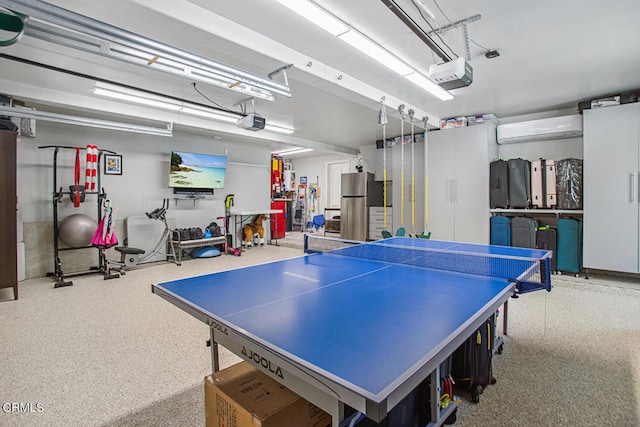 recreation room featuring a wall unit AC