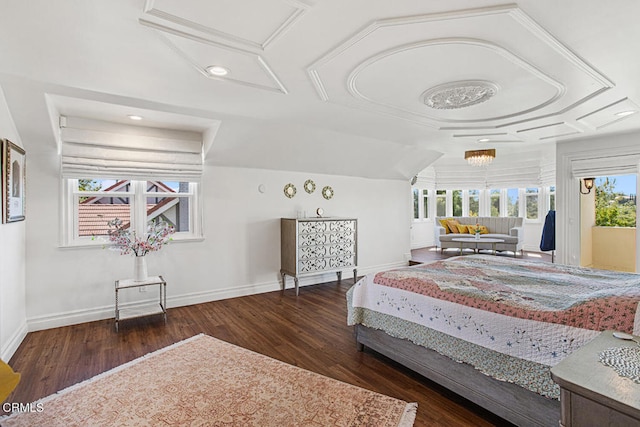 bedroom featuring a chandelier and dark wood-type flooring