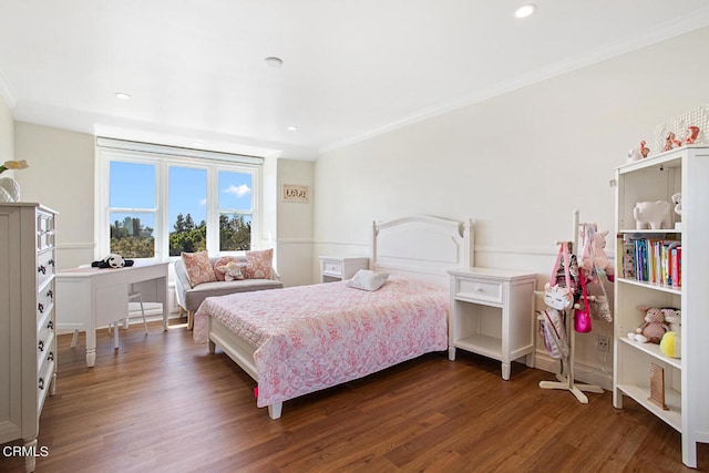 bedroom featuring crown molding and dark hardwood / wood-style floors